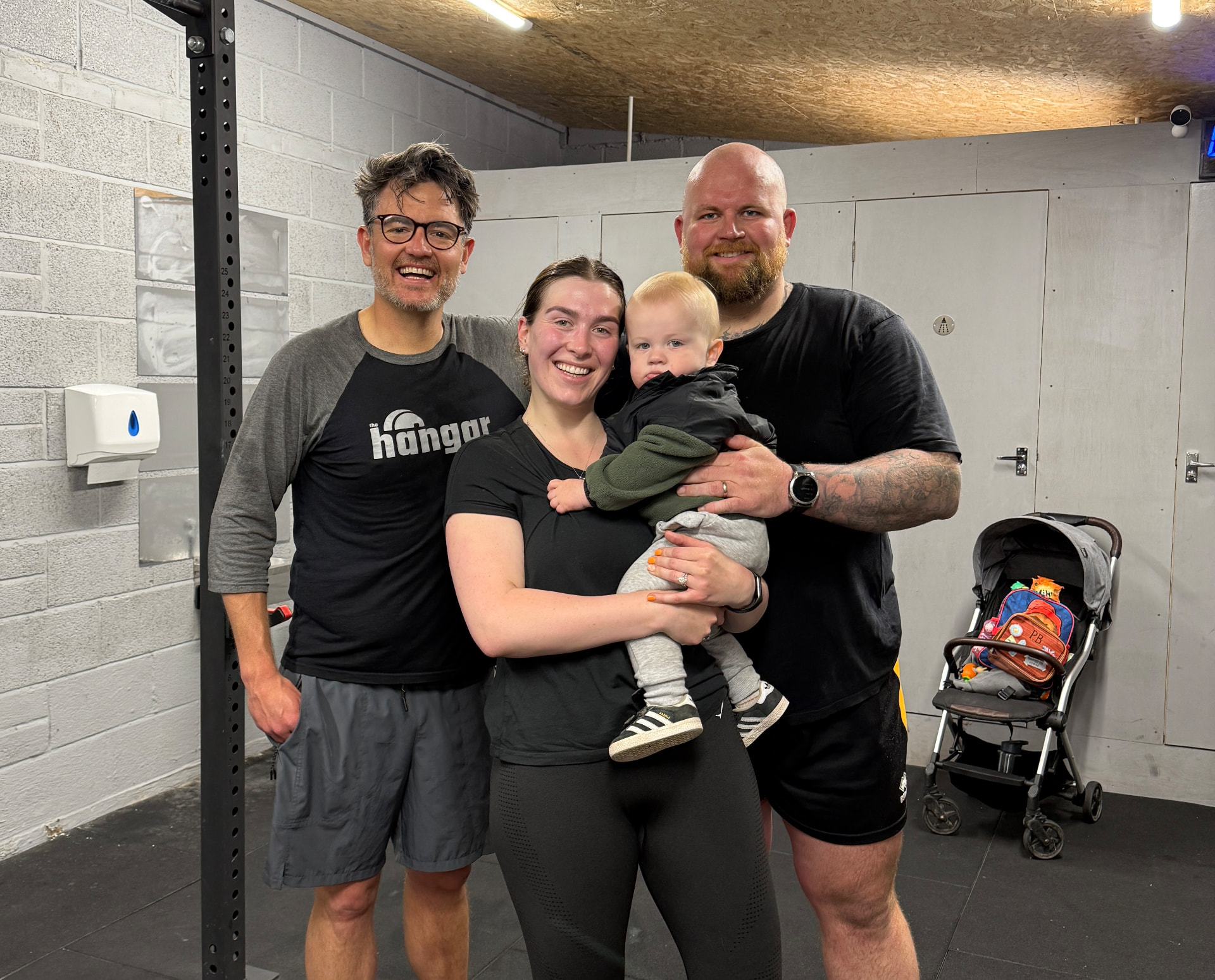 A Hangar family with their baby at the gym