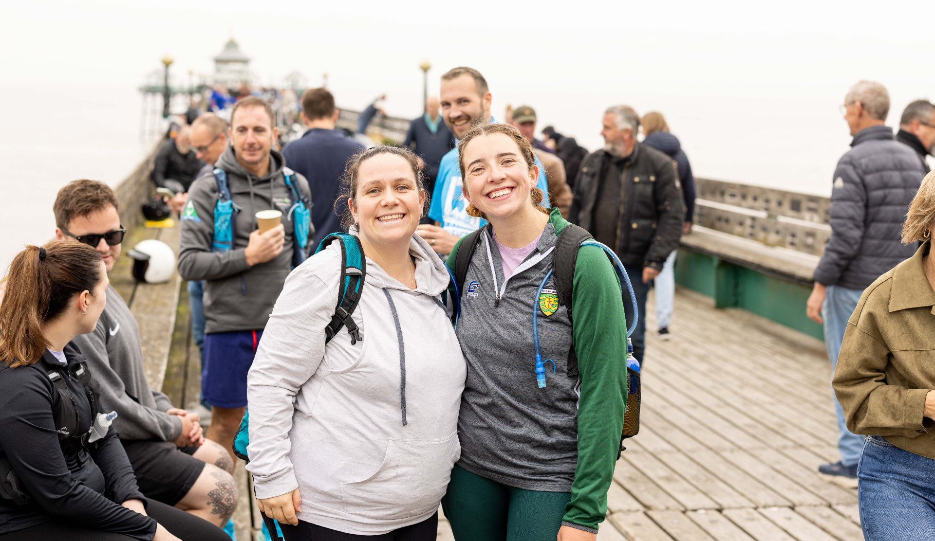 Two participants smiling together on Clevedon Pier